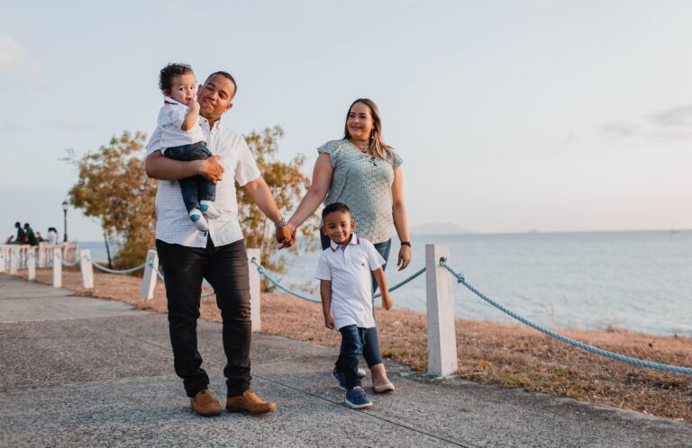 family walking down lakeside road