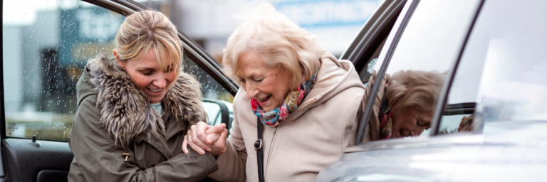 women getting out of car