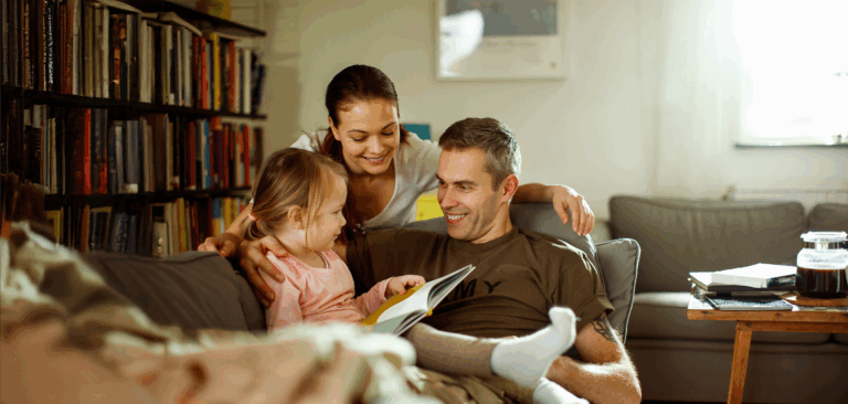 Veteran sitting in living room with family